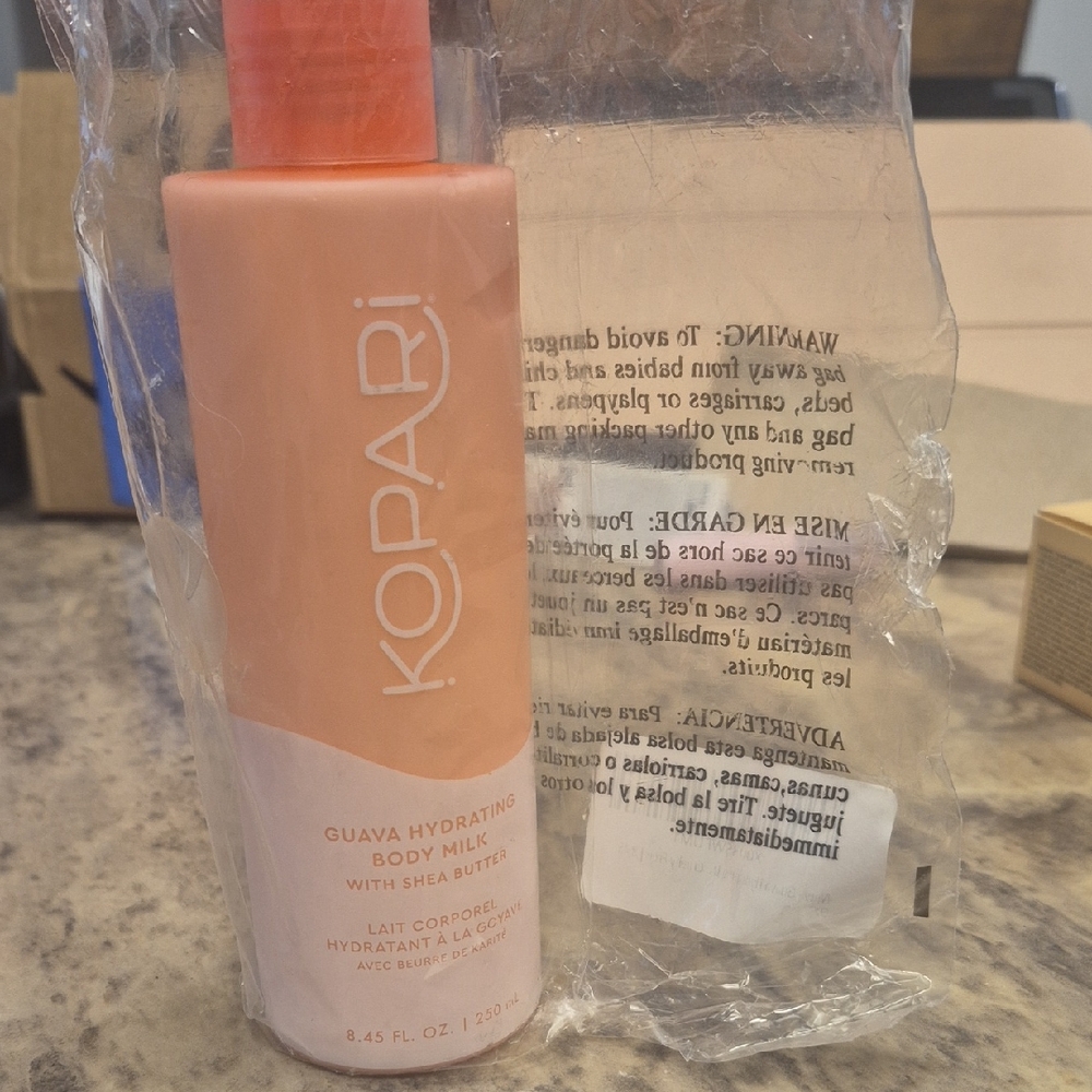 Kopari Guava Hydrating Body Milk in Peach Bottle